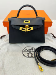 Hermès Mini Kelly in black Epsom leather with gold hardware.