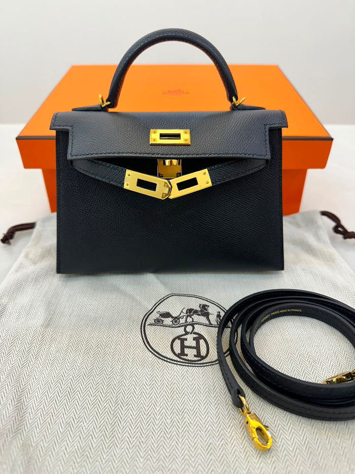 Hermès Mini Kelly in black Epsom leather with gold hardware.