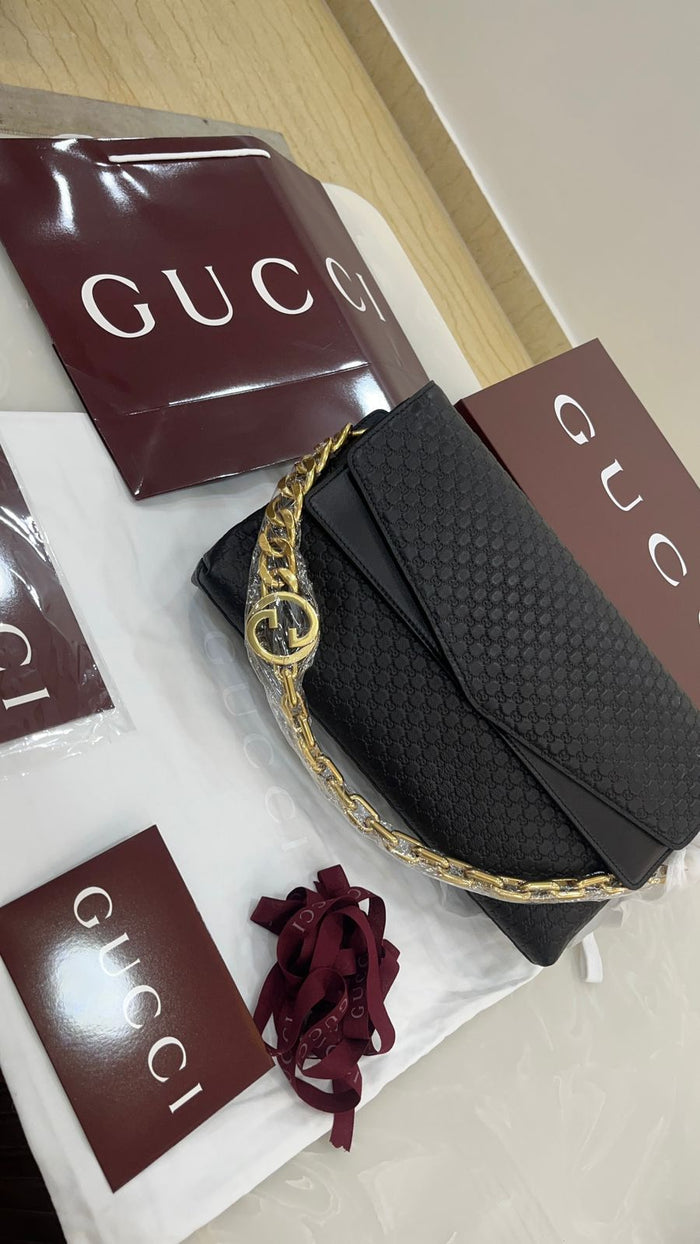Gucci black embossed leather shoulder bag
