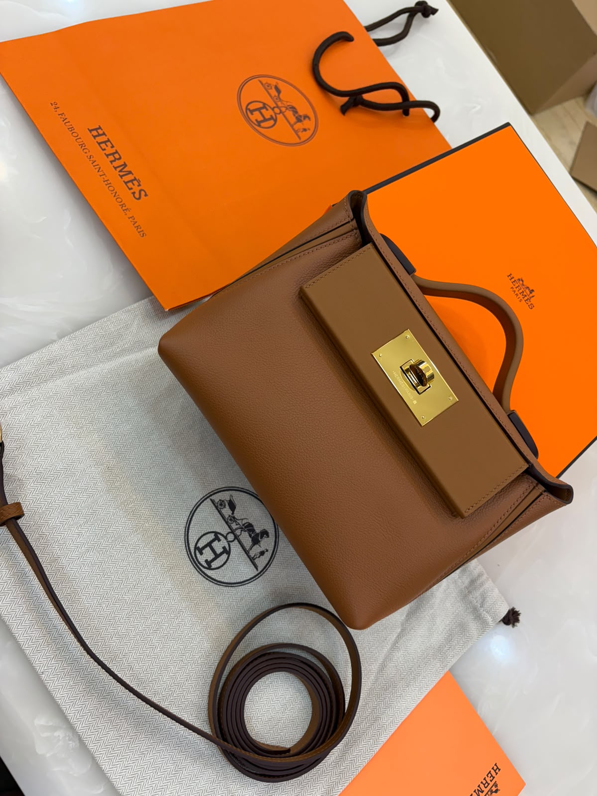 Hermès 24/24 21 bag in gold leather