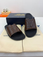 LV brown crocodile-embossed leather slides