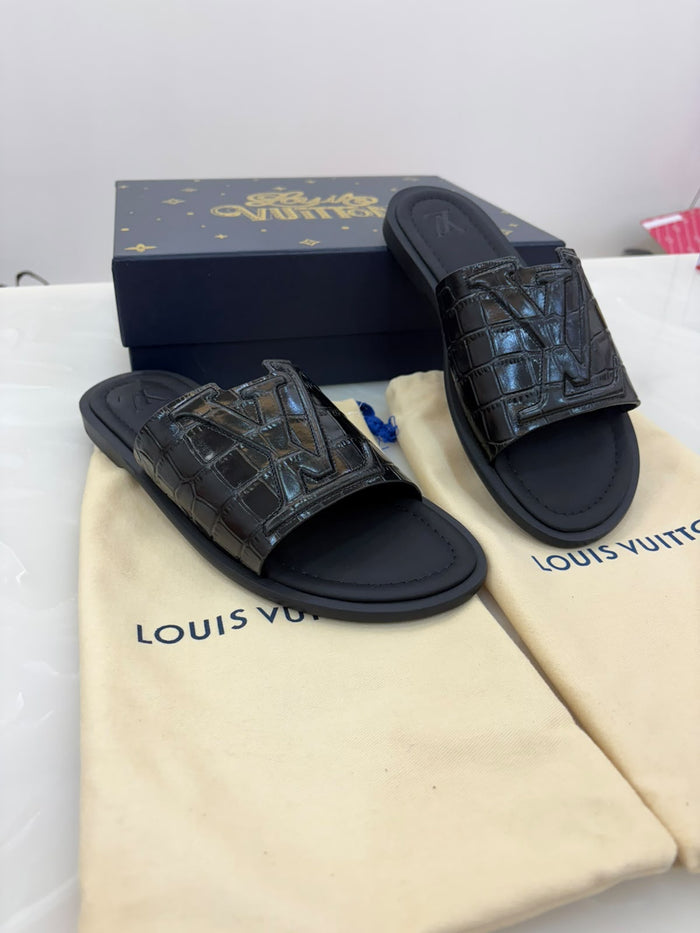 LV slide sandals featuring a crocodile-embossed