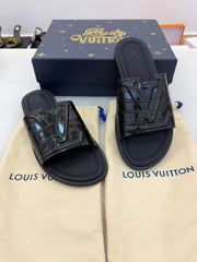 LV slide sandals featuring a crocodile-embossed