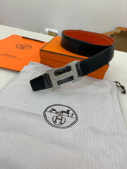Reversible leather "H" buckle and a black and orange strap