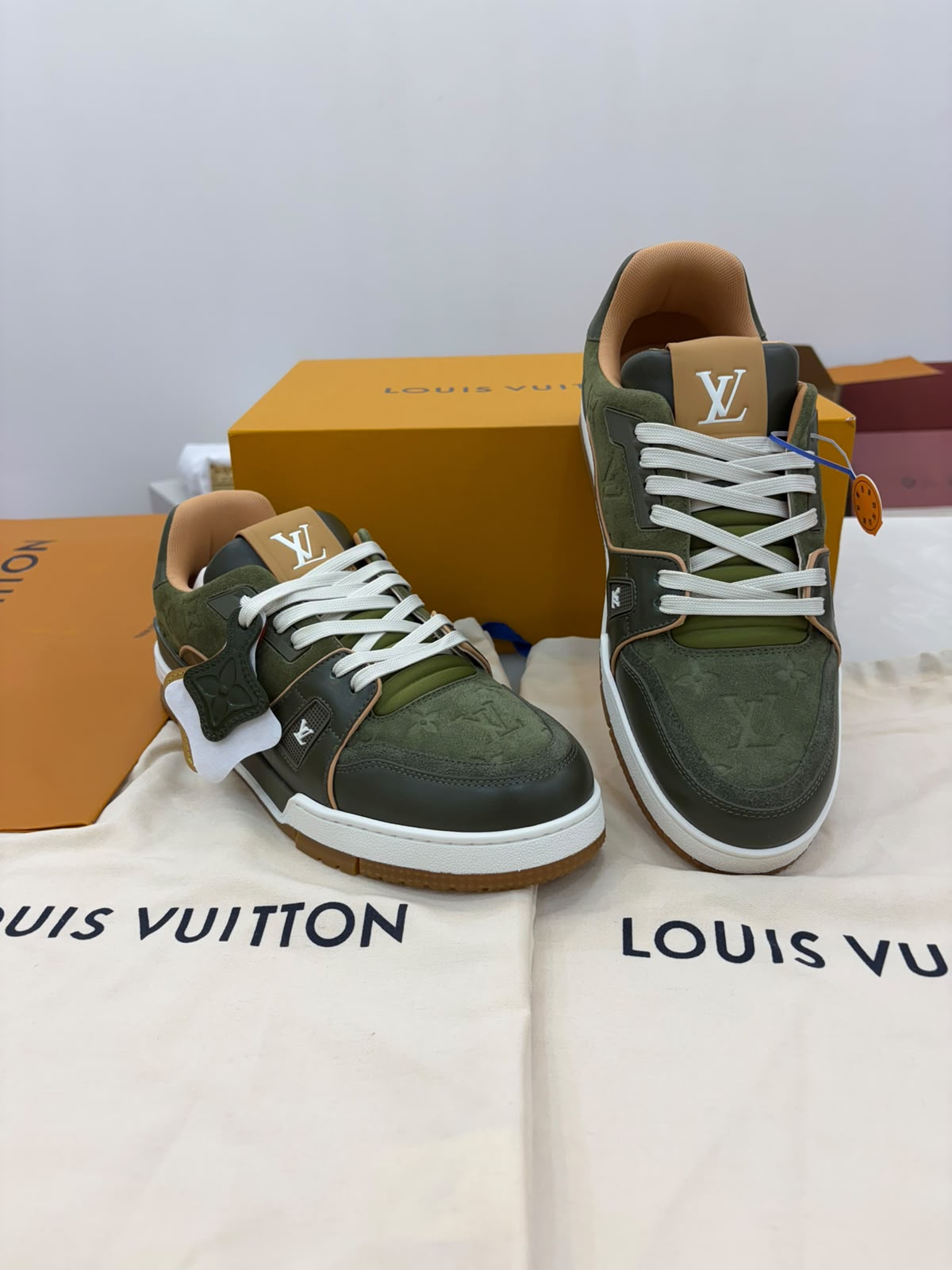 green suede calf leather on these Louis Vuitton LV Trainer Sneakers