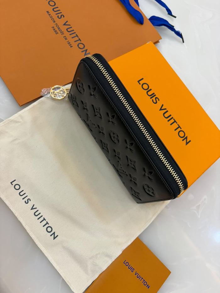 Louis Vuitton Coussin Zippy Wallet in black,