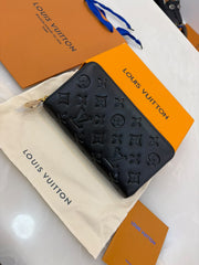 Louis Vuitton Coussin Zippy Wallet in black,