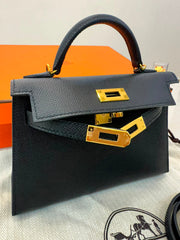 Hermès Mini Kelly in black Epsom leather with gold hardware.
