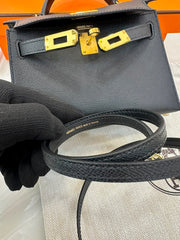 Hermès Mini Kelly in black Epsom leather with gold hardware.