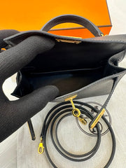 Hermès Mini Kelly in black Epsom leather with gold hardware.